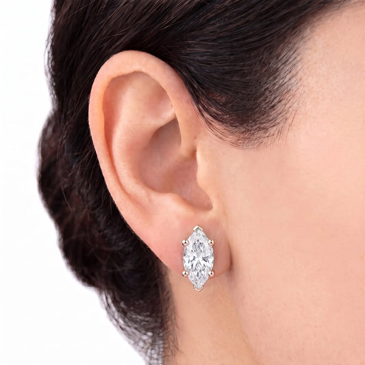 Marquise cut diamond stud earring in rose gold worn on ear