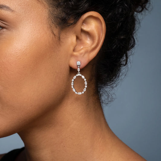 14KT White Gold Diamond Oval Hoop Drop Earrings - worn close up