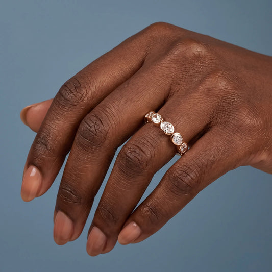 14K Rose Gold Seven Stone Oval Cut Bezel Set Diamond Half Eternity Wedding Band - worn on hand