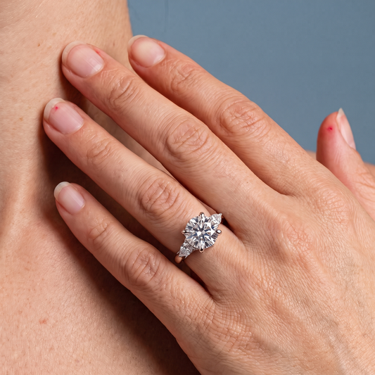 14 KT Rose Gold Round Cut Diamond Cluster Engagement Ring with Pear Accents - worn close-up