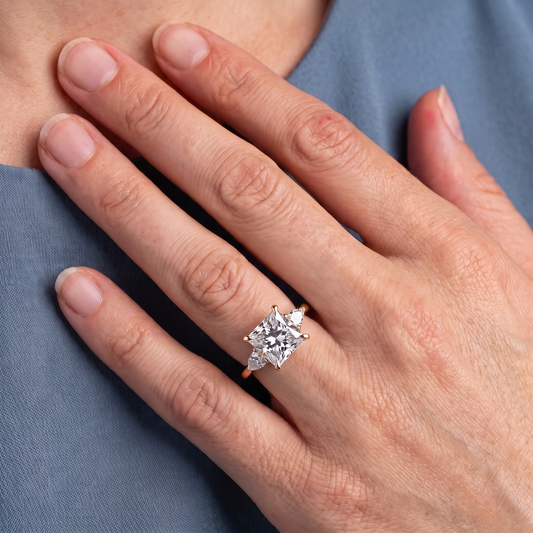 18 KT Yellow Gold Princess Cut Diamond Cluster Engagement Ring with Pear Accents - worn close-up