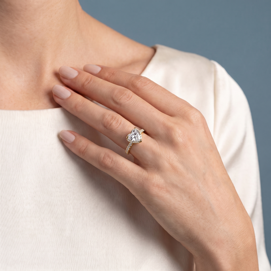 18 KT Yellow Gold Heart Cut Diamond Solitaire Ring with Pave Eternity Band - worn close-up