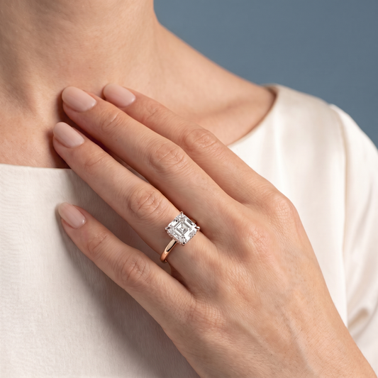 14 KT Rose Gold Asscher Cut Diamond Solitaire Ring with Hidden Halo - worn close-up