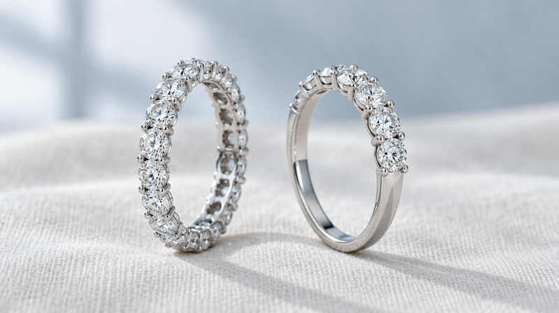 A full eternity diamond band beside a seven stone anniversary band in platinum