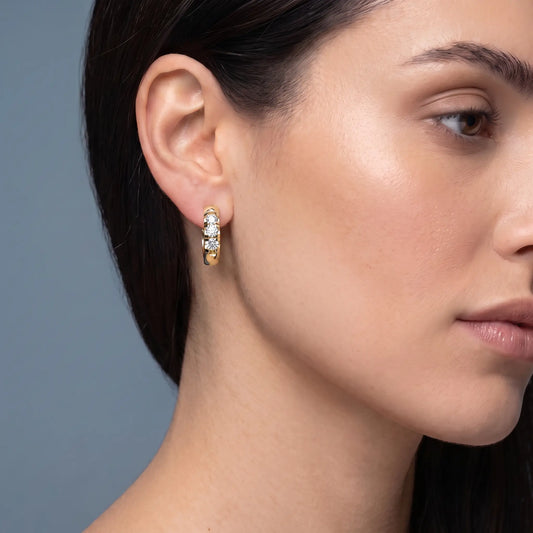 14KT Yellow Gold Diamond Huggie Hoop Earrings - worn close up