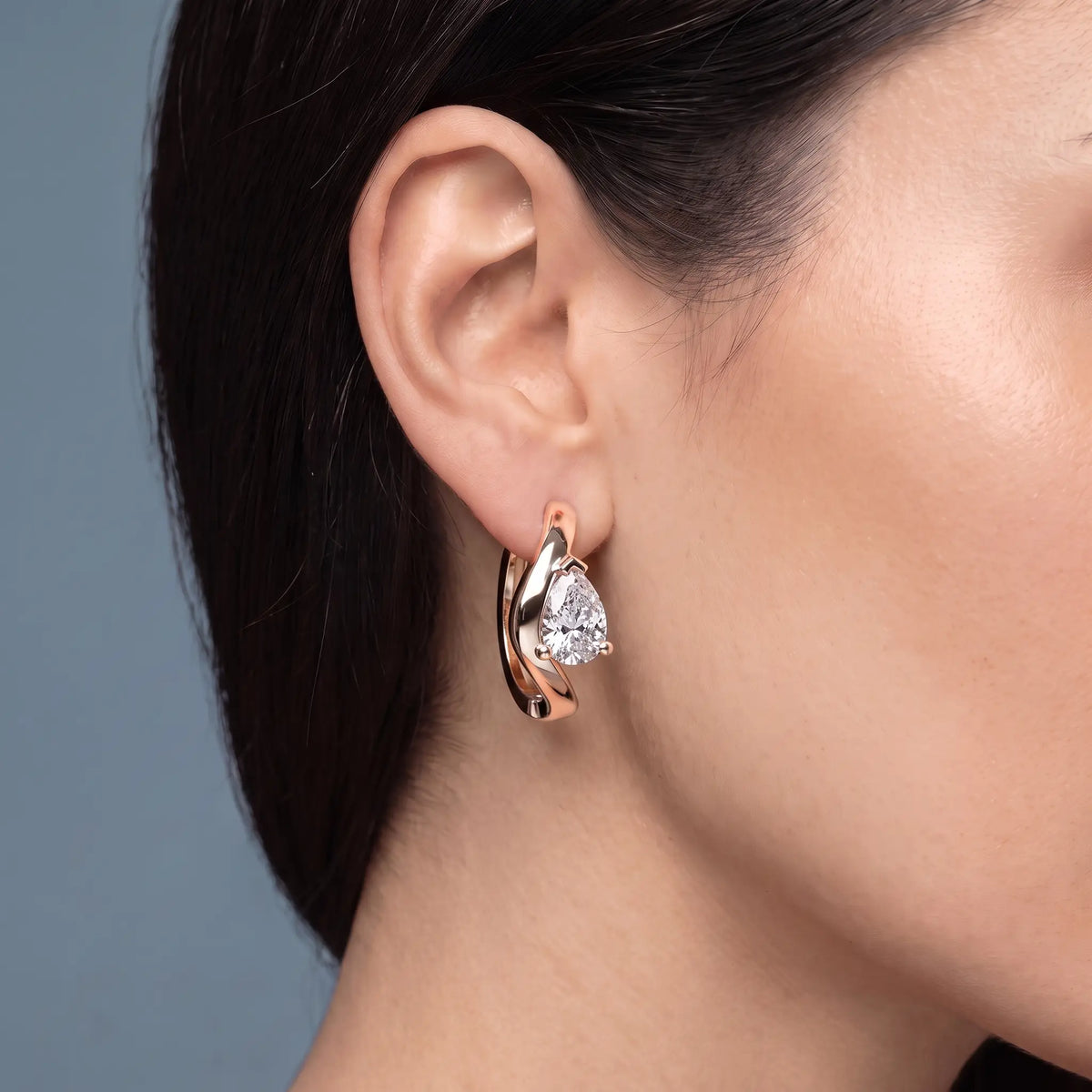 10KT Rose Gold Pear Diamond Three-Stone Hoop Earrings - worn close up