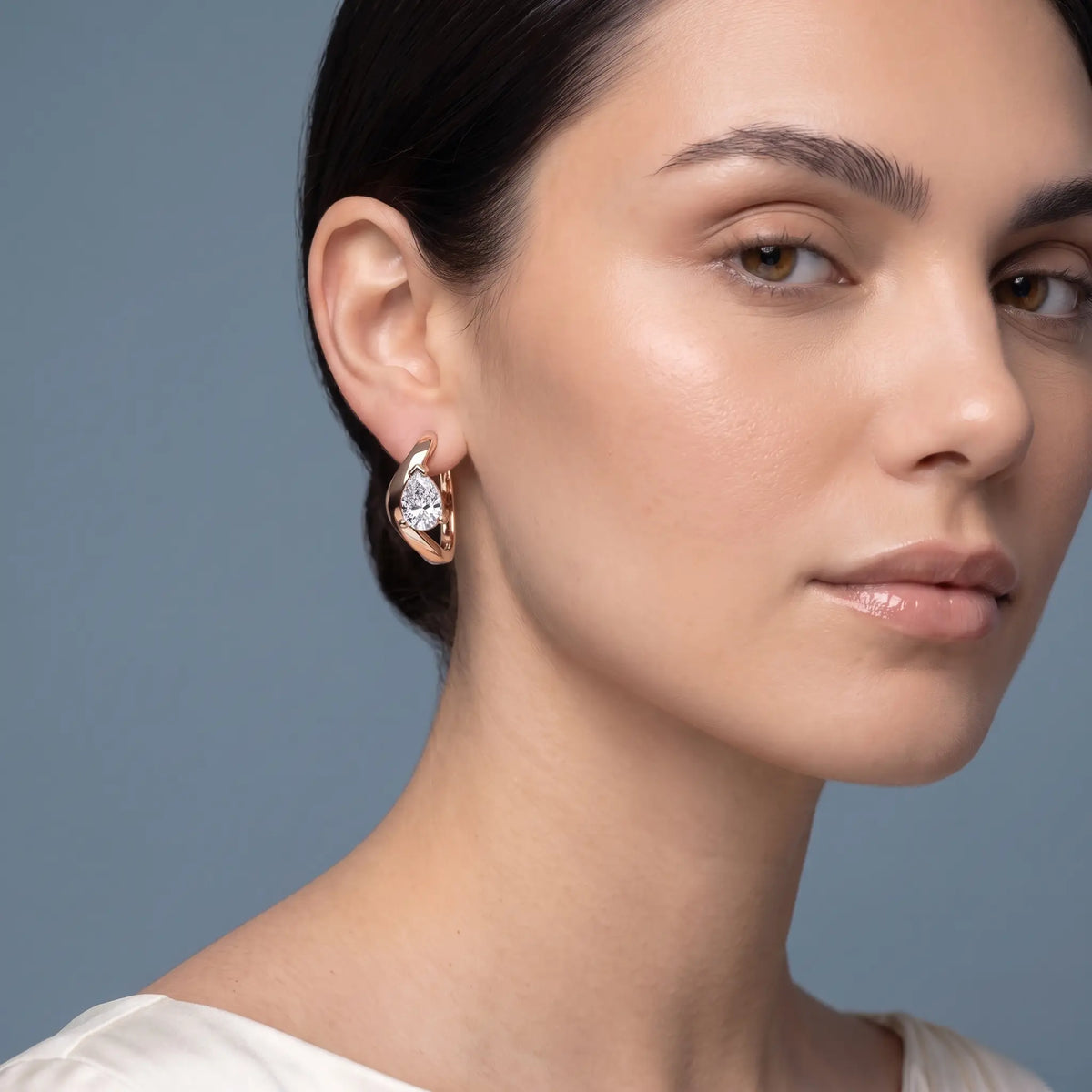 10KT Rose Gold Pear Diamond Three-Stone Hoop Earrings - model beauty shot