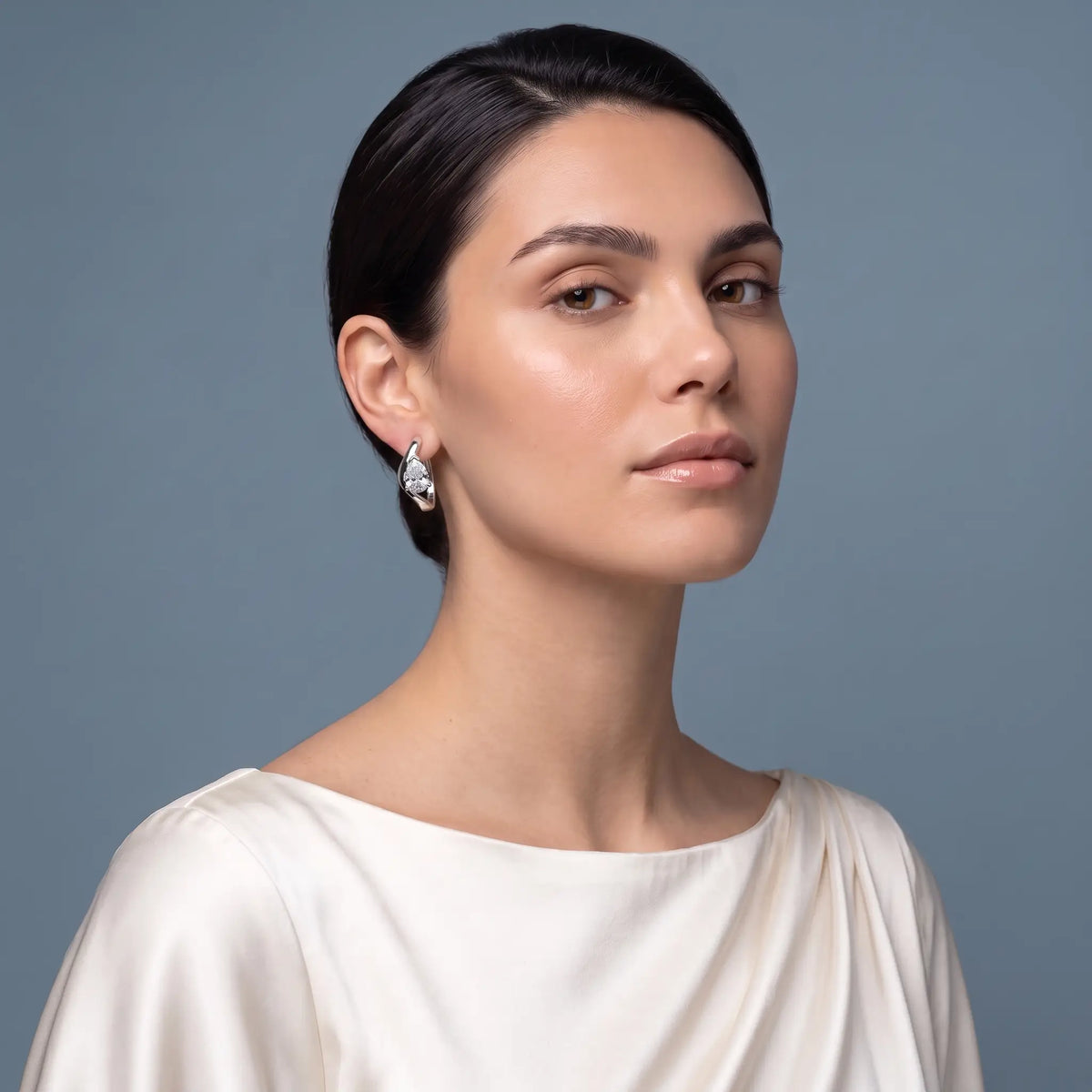 10KT White Gold Pear Diamond Three-Stone Hoop Earrings - model beauty shot