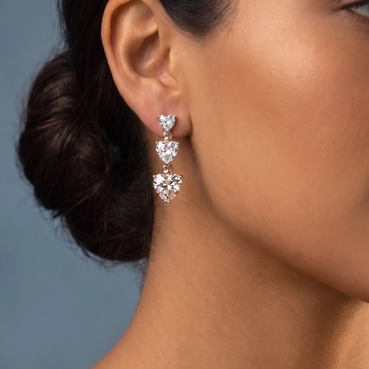 14KT Rose Gold Diamond Three Heart Drop Earrings - worn close up
