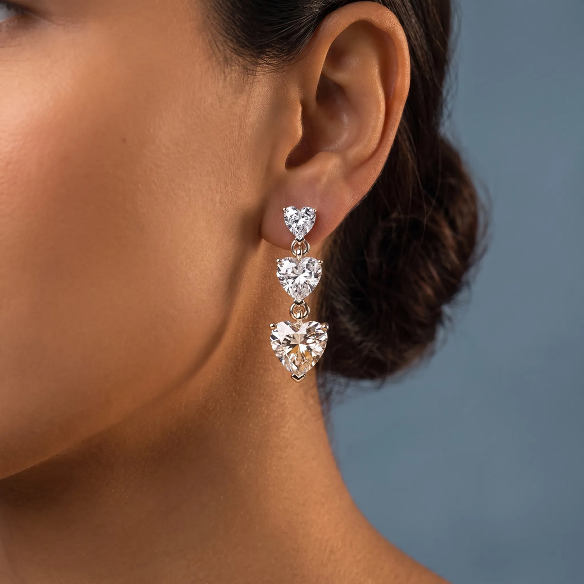 10KT Yellow Gold Diamond Three Heart Drop Earrings - worn close up