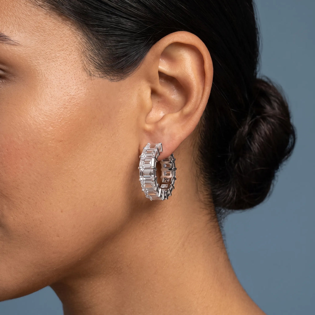 Platinum Diamond Emerald Hoop Earrings - worn close up