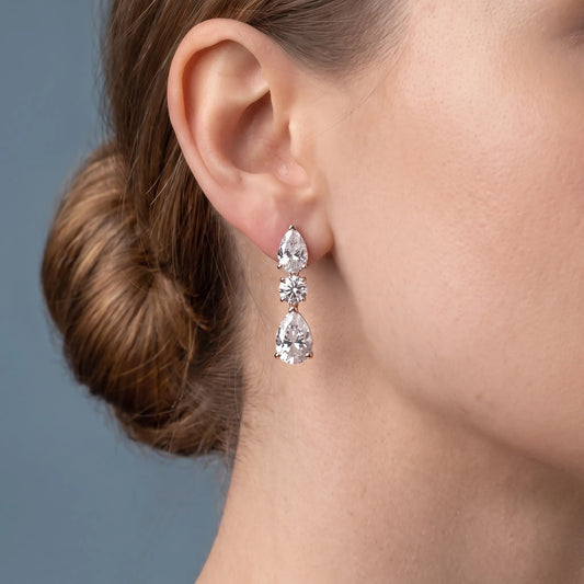 10KT Rose Gold Diamond Pear Round Three Stone Earrings - worn close up