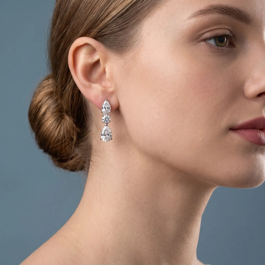 Silver Diamond Pear Round Three Stone Earrings - worn close up