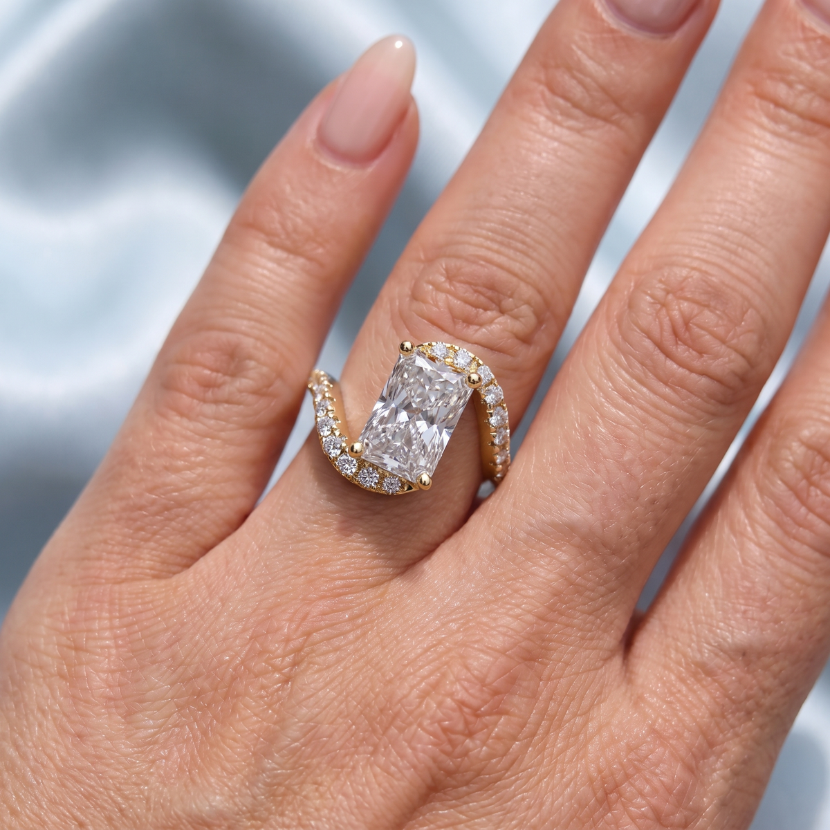 Yellow Gold Radiant Cut Diamond Solitaire Ring with Pave Wave Band - On finger