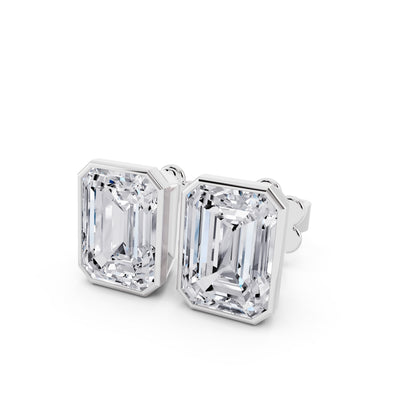 Bezel emerald cut diamond stud earrings close up view