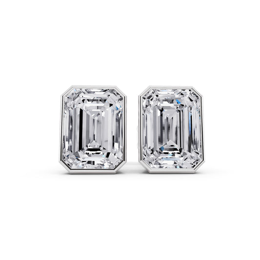 Bezel emerald cut diamond stud earrings front view