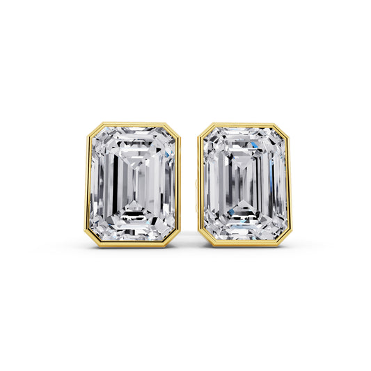 Bezel emerald cut diamond stud earrings yellow gold front view