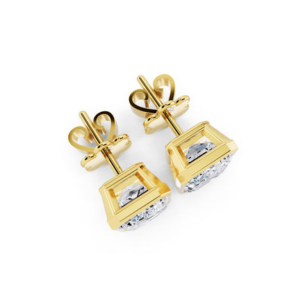 Bezel emerald cut diamond stud earrings yellow gold top view