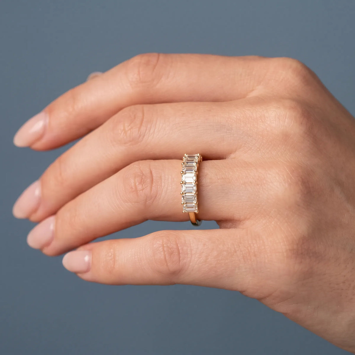 14K Yellow Gold Seven Stone Emerald Cut Diamond Half Eternity Wedding Band - worn on hand