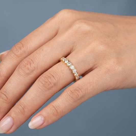 10K Yellow Gold Round Cut Bezel Set Diamond Full Eternity Wedding Band 2.4mm - worn on hand