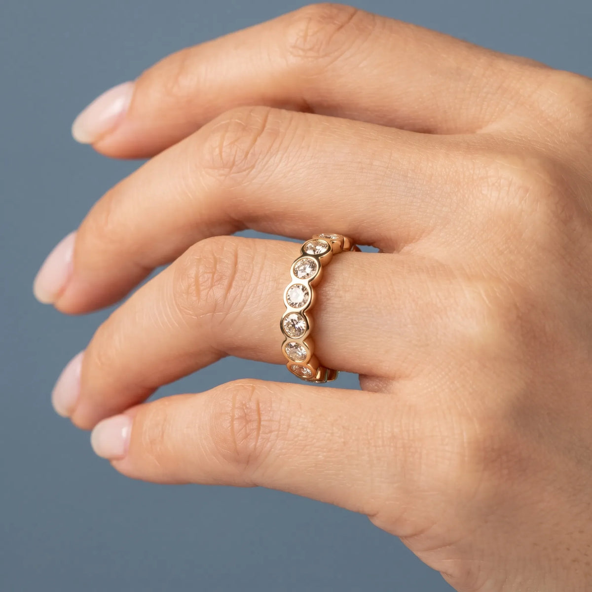 10K Yellow Gold Round Cut Bezel Set Diamond Full Eternity Wedding Band 3.5mm - worn on hand