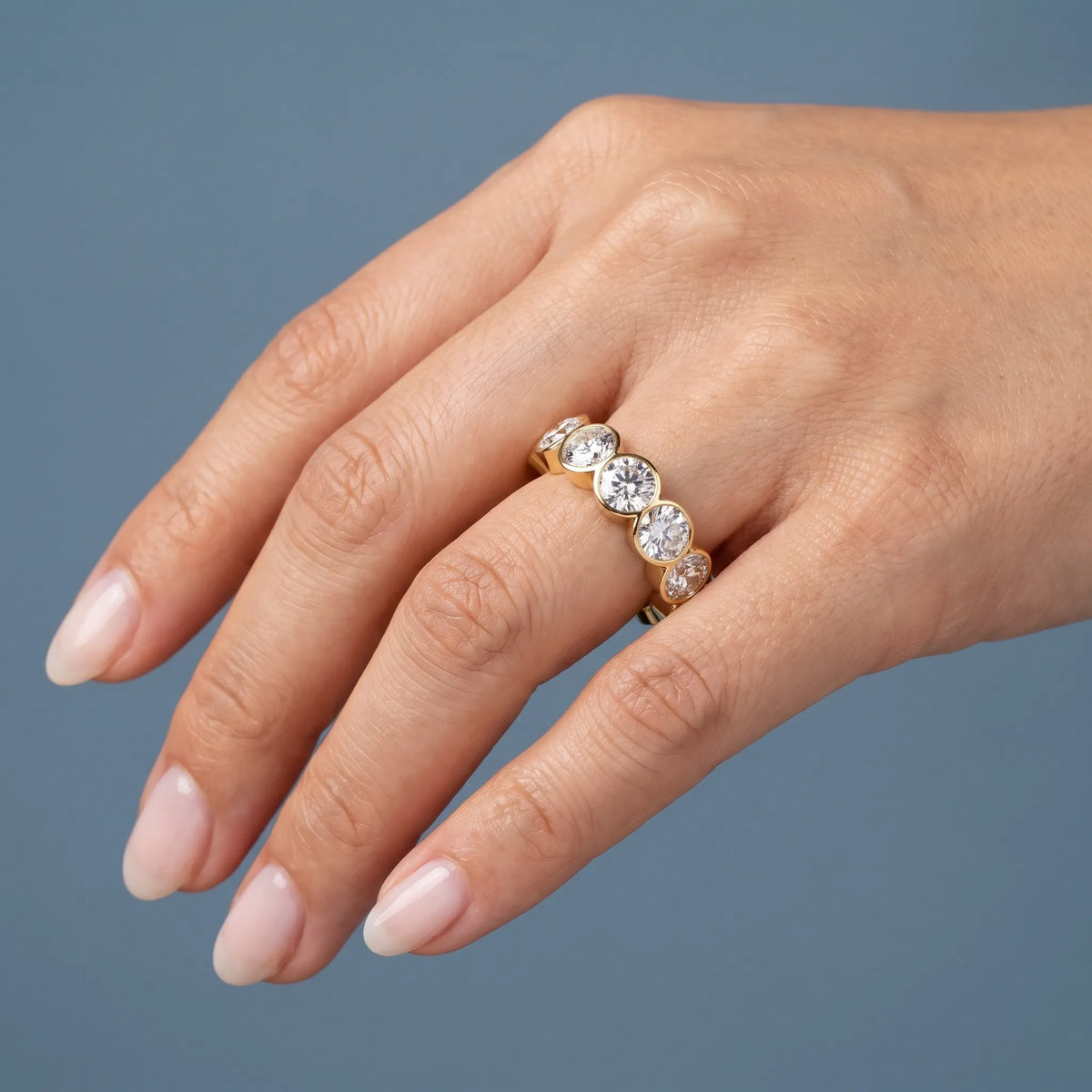 14K Yellow Gold Round Cut Bezel Set Diamond Full Eternity Wedding Band 5.9mm - worn on hand