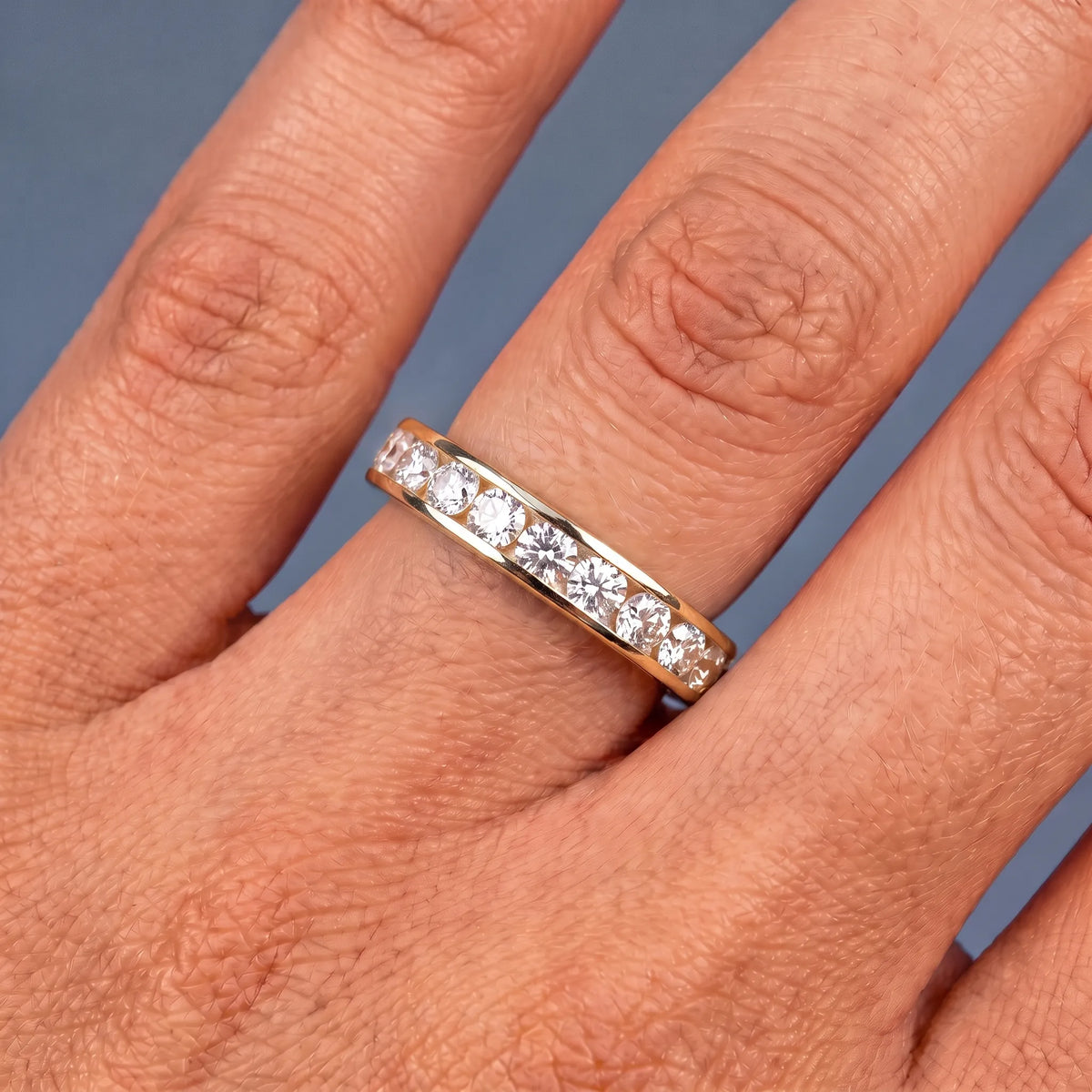 10K Yellow Gold Round Cut Diamond Channel Set Eternity Band 2.3mm - worn on hand