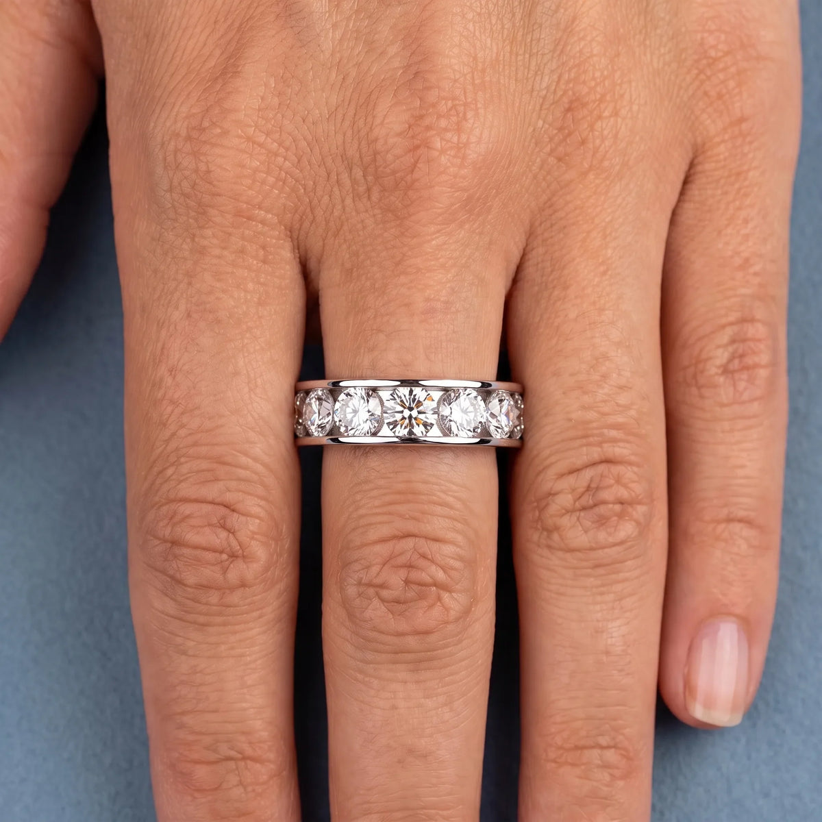 14K White Gold Round Cut Diamond Channel Set Eternity Band 4.2mm - worn on hand