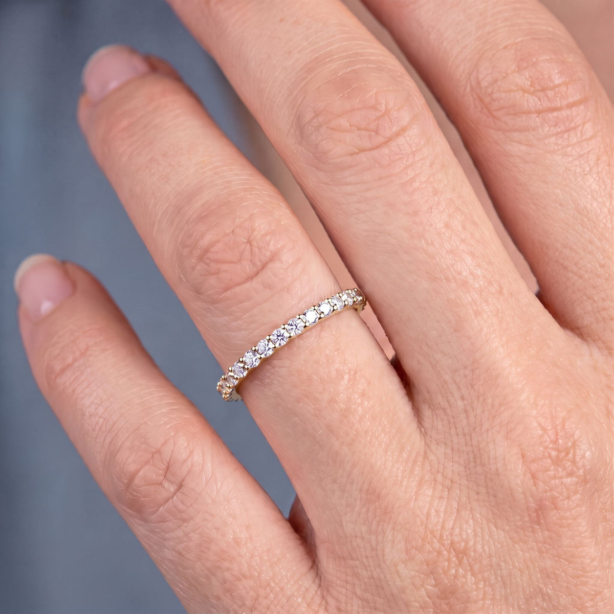 10K Yellow Gold Round Cut Diamond 4 Prong Eternity Band 1.8mm - worn on hand