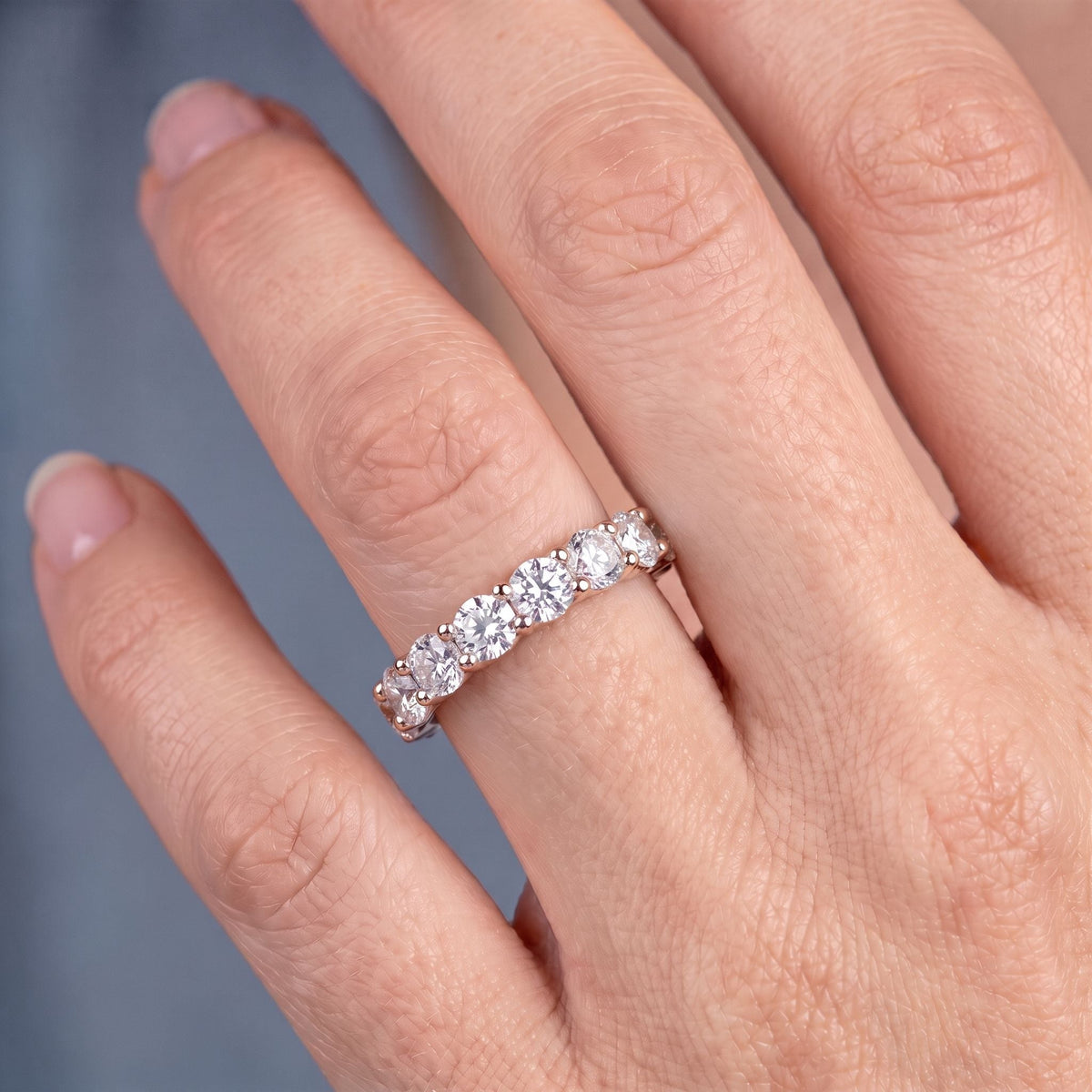 10K Rose Gold Round Cut Diamond 4 Prong Eternity Band 2mm - worn on hand