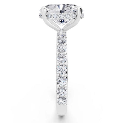 18 KT White Gold Oval Cut Diamond Solitaire Ring with Hidden Halo and Pave Band - side view