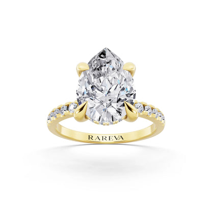 18 KT Yellow Gold Pear Cut Diamond Solitaire Ring with Round Pavé Band and Prong Setting - front view