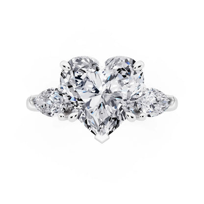Platinum Heart Cut Diamond Three Stone Pear Accent Ring - top angle