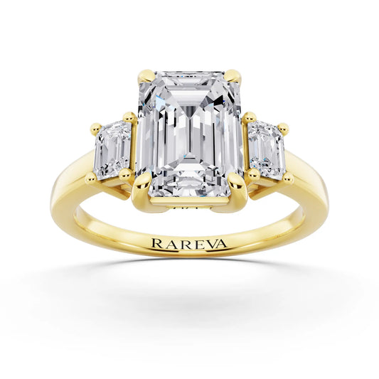 18 KT Yellow Gold Emerald Cut Diamond Three Stone Emerald Accent Ring - front view