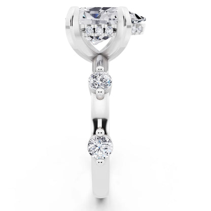 14 KT White Gold Pear Cut Diamond Solitaire Ring with Floating Diamond Accents - side view