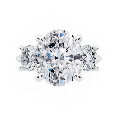 Platinum Oval Cut Diamond Three Stone Ring with Round Accents - top angle