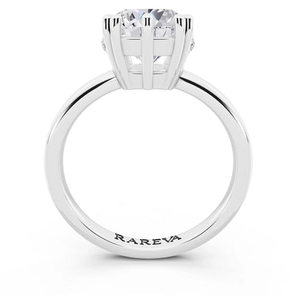 Platinum Round Cut Diamond Solitaire Ring with Hidden Accent Basket - through finger