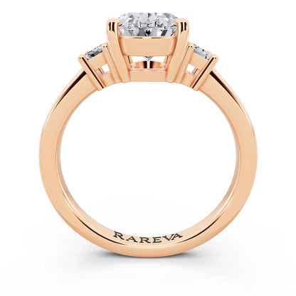 18 KT Rose Gold Oval Cut Diamond Three Stone Emerald Accent Ring - through finger