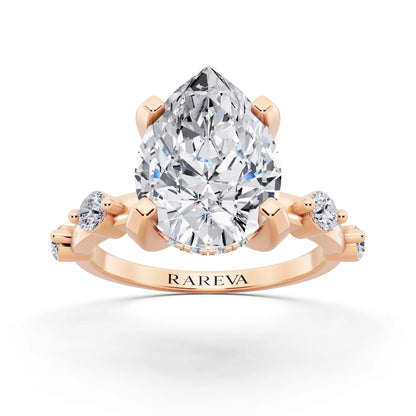 14 KT Rose Gold Pear Cut Diamond Solitaire Ring with Floating Diamond Accents - front view