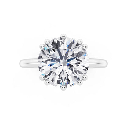 Platinum Round Cut Diamond Solitaire Ring with Hidden Accent Basket - top angle