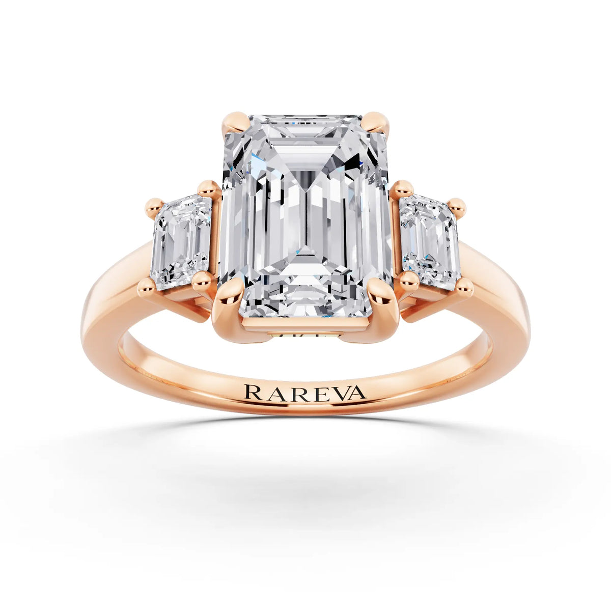 18 KT Rose Gold Emerald Cut Diamond Three Stone Emerald Accent Ring - front view