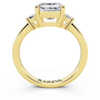 18 KT Yellow Gold Asscher Cut Diamond Three Stone Emerald Accent Ring - through finger