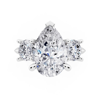 18 KT White Gold Pear Cut Diamond Three Stone Ring with Round Accents - top angle