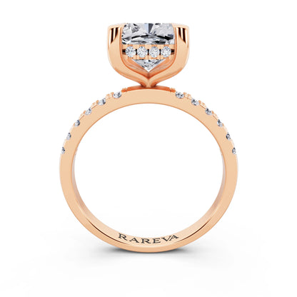 18 KT Rose Gold Cushion Cut Diamond Solitaire Ring with Round Pavé Band and Prong Setting - through finger