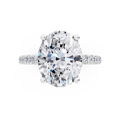 18 KT White Gold Oval Cut Diamond Solitaire Ring with Hidden Halo and Pave Band - top angle