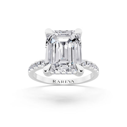 Platinum Emerald Cut Diamond Solitaire Ring with Round Pavé Band and Prong Setting - front view