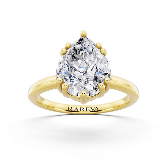 14 KT Yellow Gold Pear Cut Diamond Solitaire Ring with Hidden Accent Basket - front view
