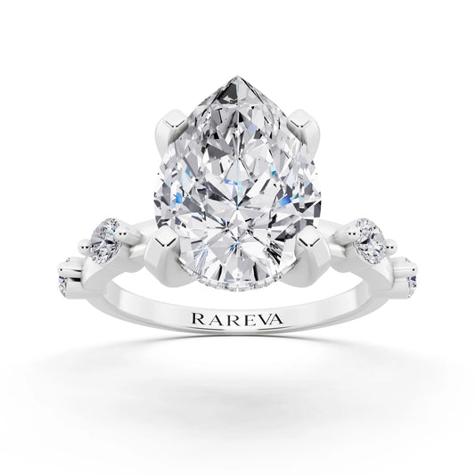18 KT White Gold Pear Cut Diamond Solitaire Ring with Floating Diamond Accents - front view