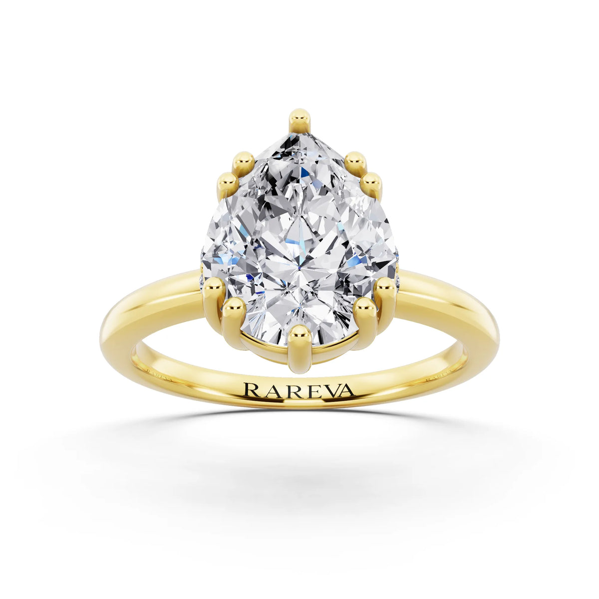 18 KT Yellow Gold Pear Cut Diamond Solitaire Ring with Hidden Accent Basket - front view