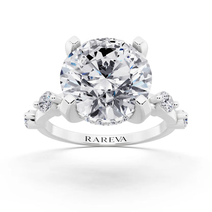 18 KT White Gold Round Cut Diamond Solitaire Ring with Floating Diamond Accents - front view
